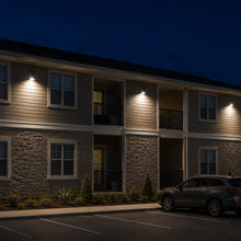 Installed 100 watt full cutoff LED wall pack providing exterior security and perimeter lighting for apartment complex