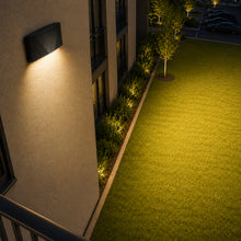 Installed 55 watt modern LED wall pack providing exterior building security and area lighting